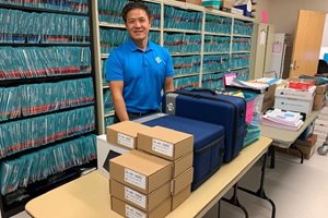 TSI's Long Yang prepares donated equipment
