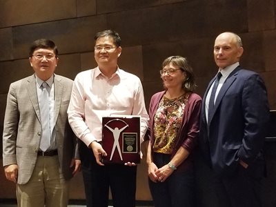 Dr. David Pui (L. M. Fingerson/TSI Chair in Mechanical Engineering), Dr. Hong He, Dr. Susan Mantell (Mechanical Engineering Department Head), and Dr. Tom Kennedy (President/CEO, TSI Incorporated)
