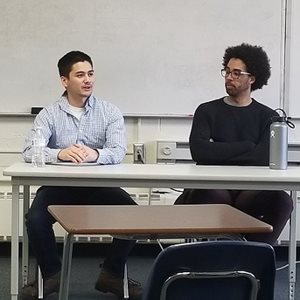 TSI's Joseph Kwong (L) speaks to students about software engineering